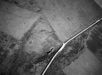 Oblique aerial view centred on the remains of the stone rows at the Hill O' Many Stanes, Clyth, looking to the W.