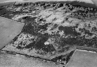 Oblique aerial view centred on the remains of the enclosure at Hill of Keir, looking to the NW.