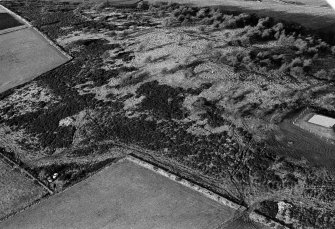 Oblique aerial view centred on the remains of the enclosure at Hill of Keir, looking to the NW.