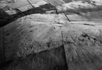 Oblique aerial view centred on the remains of the fort at Durn Hill, looking to the SE.