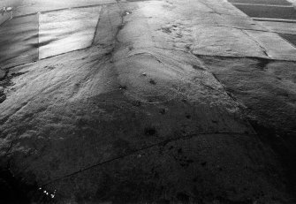 Oblique aerial view centred on the remains of the fort at Durn Hill, looking to the SW.