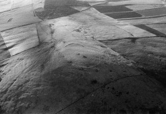 Oblique aerial view centred on the remains of the fort at Durn Hill, looking to the SW.