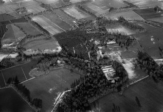 Oblique aerial view centred on Fasque House and policies, looking to the NNE.