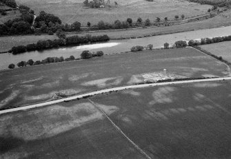 Oblique aerial view centred on the excavation of the timber hall at Balbridie, looking to the NE.