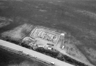 Oblique aerial view centred on the excavation of the timber hall at Balbridie, looking to the NNW.