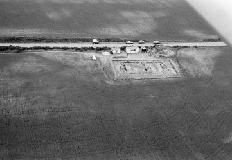 Oblique aerial view centred on the excavation of the timber hall at Balbridie, looking to the SSW.