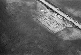 Oblique aerial view centred on the excavation of the timber hall at Balbridie, looking to the SE.