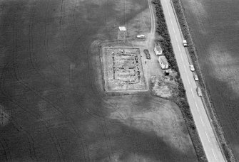 Oblique aerial view centred on the excavation of the timber hall at Balbridie, looking to the ESE.
