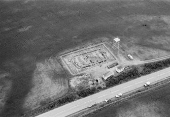 Oblique aerial view centred on the excavation of the timber hall at Balbridie, looking to the ENE.