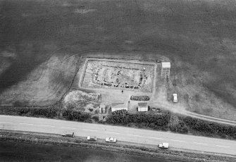 Oblique aerial view centred on the excavation of the timber hall at Balbridie, looking to the NNW.