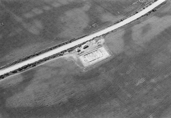 Oblique aerial view centred on the excavation of the timber hall at Balbridie, looking to the SSW.