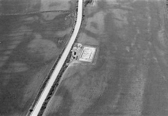 Oblique aerial view centred on the excavation of the timber hall at Balbridie, looking to the W.