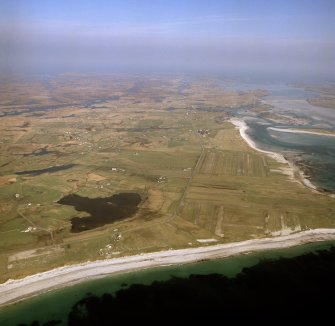 General oblique aerial view looking across Benbecula, with the crofting townships in the foreground, taken from the W.