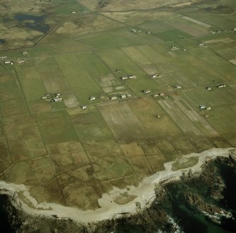 Oblique aerial view centred on the crofting township, taken from the WNW.