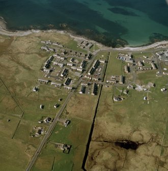 Oblique aerial view centred on Balivanich village, Benbecula, taken from the S.