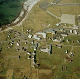 Oblique aerial view centred on Balivanich village, Benbecula, taken from the SSW.