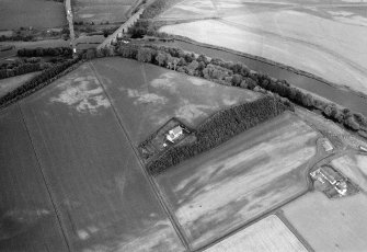 Oblique aerial view centred on the cropmarks of the palisaded enclosure, square and round barrows at Fisherhills with the North Water viaduct adjacent, looking to the WNW.