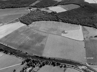 Oblique aerial view centred on the cropmarks of the Roman Temporary Camp at Burnfield with the enclosure at Brownhill Wood adjacent, looking to the ESE.