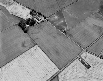 Oblique aerial view centred on the cropmarks of the unenclosed settlement, rectilinear enclosures, souterrains, ring ditches, linear features and pits at Newbarns, looking to the ESE.
