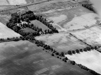 Oblique aerial view of the cropmarks of the unenclosed settlements and barrow at West Broomley, looking to the S.