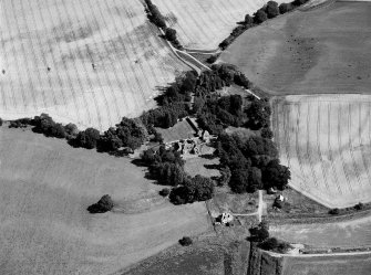 Oblique aerial view of Tarradale House with the cropmarks adjacent, looking to the NNW.