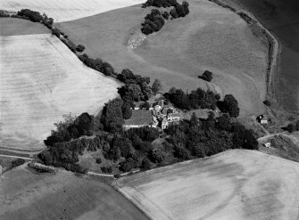 Oblique aerial view of Tarradale House with the cropmarks adjacent, looking to the ESE.