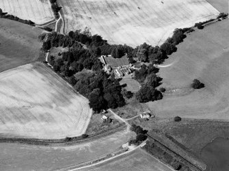 Oblique aerial view of Tarradale House with the cropmarks adjacent, looking to the NNE.