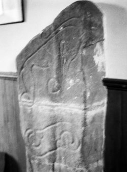 General view of front of Mortlach Pictish symbol stone no 2 showing an incised scrolled symbol and elephant symbol.