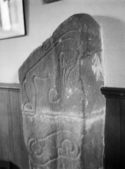 General view of front of Mortlach Pictish symbol stone no 2 showing an incised scrolled symbol and elephant symbol.