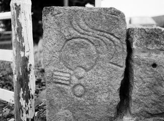 Detail of face of Drummies Pictish symbol stone showing ogee and mirror and comb symbol.