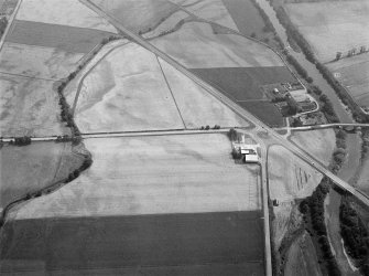 Oblique aerial view centred on North Water Bridge and the A90, looking to the ESE.