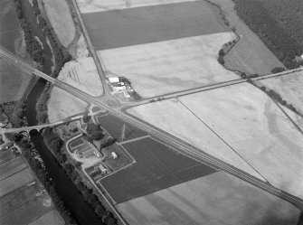 Oblique aerial view centred on North Water Bridge and the A90, looking to the WNW.