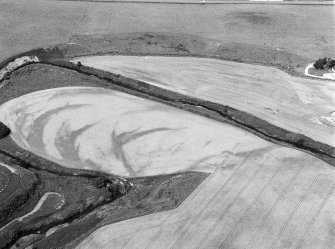 Oblique aerial view centred on the remains of a pit alignment, rig and enclosures at Corbie's Pot, looking to the NW.