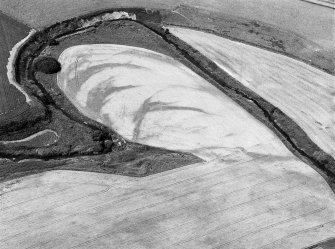 Oblique aerial view centred on the remains of a pit alignment, rig and enclosures at Corbie's Pot, looking to the WNW.