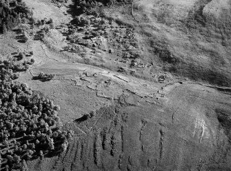 Oblique aerial view centred on the remains of the township and rig at Glen Muick, looking to the E.