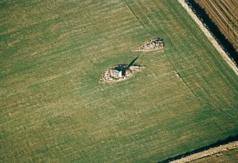 Oblique aerial view centred on the remains of the recumbent stone circle, taken from the SSW.