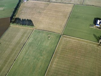 Oblique aerial view centred on the remains of the recumbent stone circle, taken from the SW.