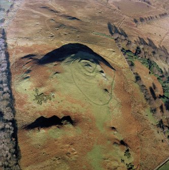 Oblique aerial view centred on the remains of Knock vitrified fort, taken from the SW.