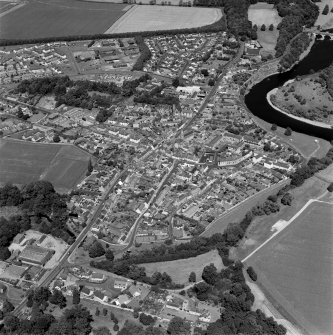 Oblique aerial view centred on the town of Coldstream with road bridge adjacent, taken from the SW.