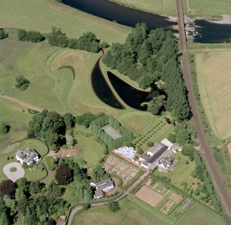 Oblique aerial view centred on the garden and country house, taken from the SSE.