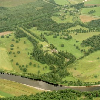 Oblique aerial view of Murthly Castle centred on the castle, chapel and walled garden, taken from the NNE.