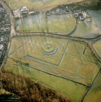 Oblique aerial view of King's Knot earthwork and garden below Striling Castle.