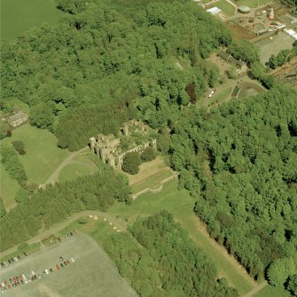Aerial view of Loudoun Castle, gardens, estate policies and fairground, taken from the SW.