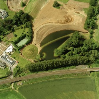 Oblique aerial view centred on Portrach House garden.