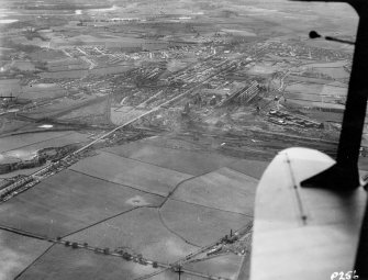 Oblique aerial view centred on the steel works.