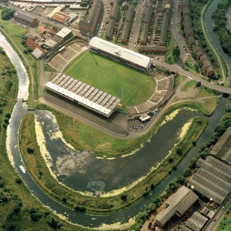 Maryhill, oblique aerial view, centred on Firhill Park and the Forth and Clyde Canal.