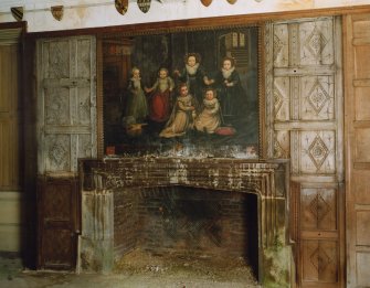 Ground floor hall, view of fireplace with painting above it; Fairfax-Lucy family portrait
