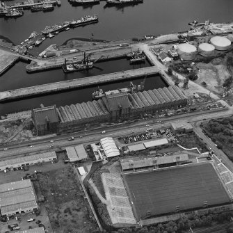 Greenock, James Watt Dock, oblique aerial view, taken from the SW. Cappielow is visible in the bottom half of the photograph.
