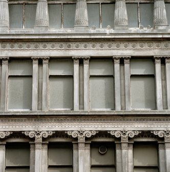 View of second floor columns on W facade.