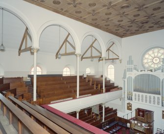 Interior. View from NE at gallery level showinfg raked seating and roof construction